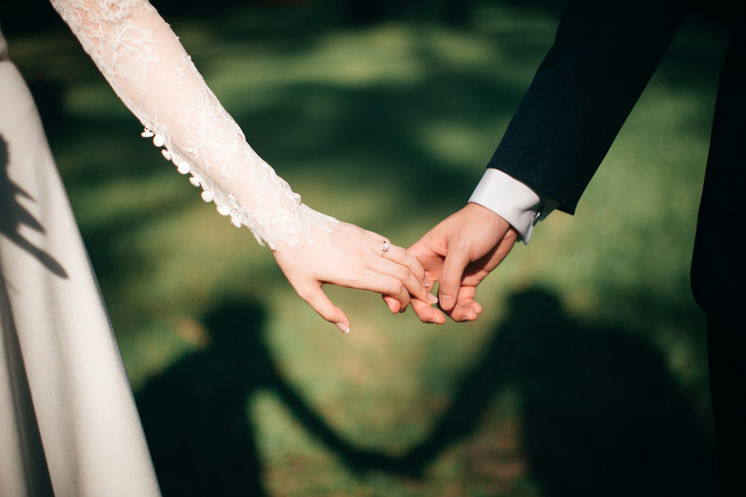 bride and groom holding hands planning budget wedding Maleny